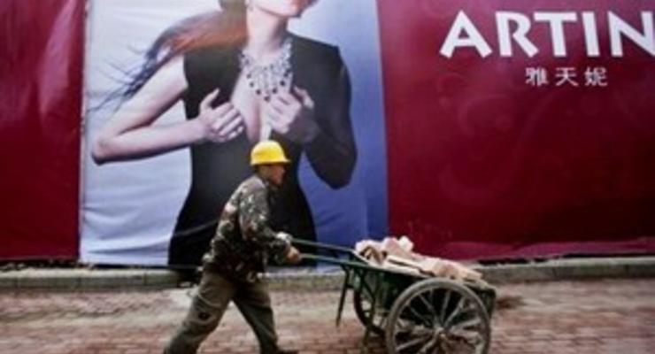 В Пекине демонтируют рекламу роскоши