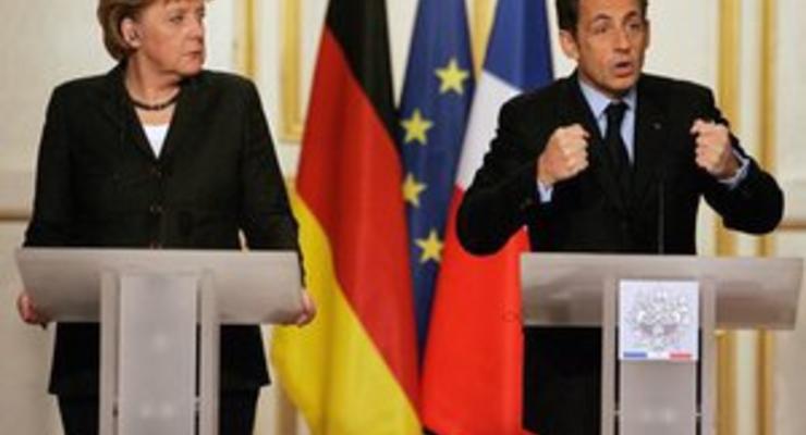 Меркель и Саркози обсуждают в Париже план спасения еврозоны