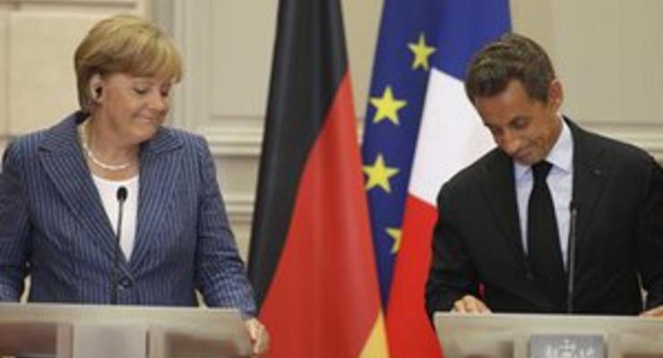Испания и Италия приветствовали решения Меркель и Саркози, но хотят большего