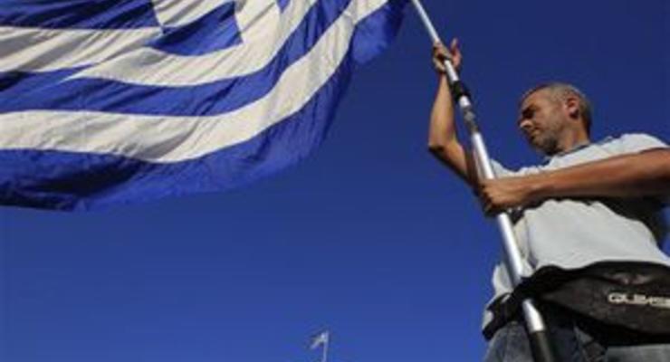 Министр финансов Греции призвал парламент решительнее сокращать госрасходы