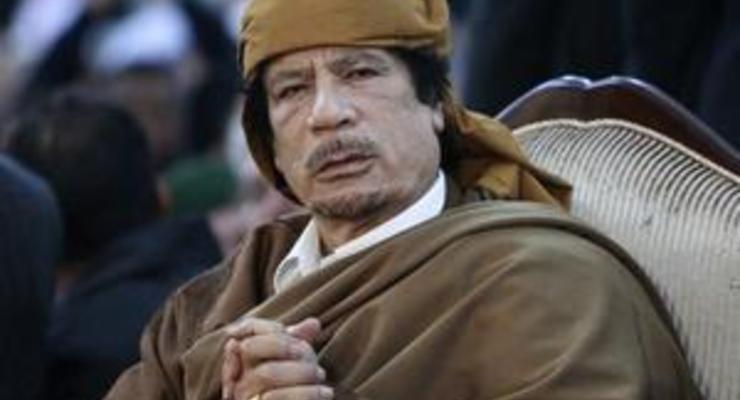СМИ: На похоронах Каддафи присутствовали четыре человека
