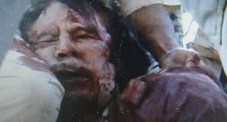 ПНС расследует сообщения о том, что Каддафи насиловали перед смертью