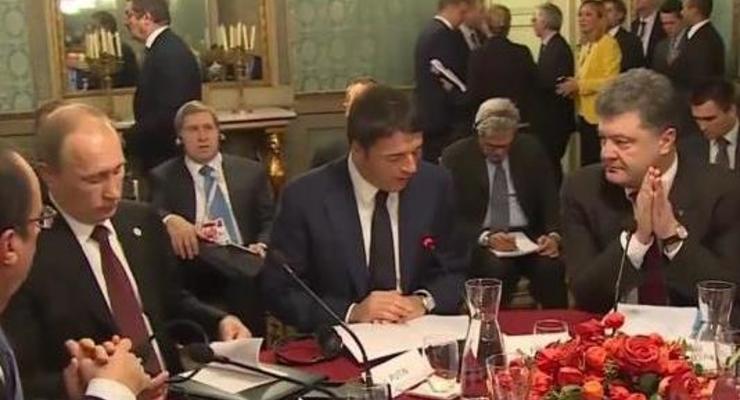 Встреча президентов в Милане: Порошенко сложил руки, а Путин листал буклет