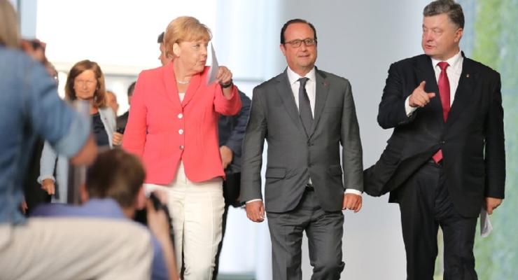 Порошенко пообещал Меркель и Олланду ускорить реформы в Украине