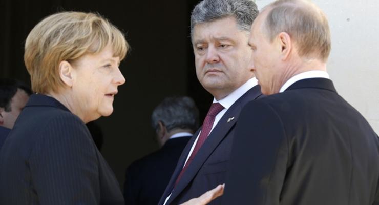 Меркель: Минские соглашения усилены парижскими гарантиями