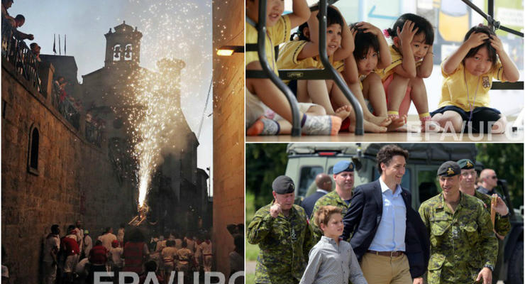 День в фото: премьер Канады во Львове, горящий бык в Испании и дети во время землетрясения