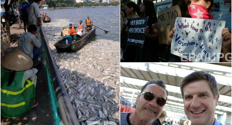 День в фото: Украинки, поддержавшие черный протест, мертвая рыба во Вьетнаме и Шварцнеггер на селфи с шефом полиции