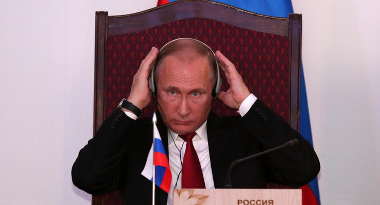 Путин потребовал от Порошенко параллельной реализации Минска