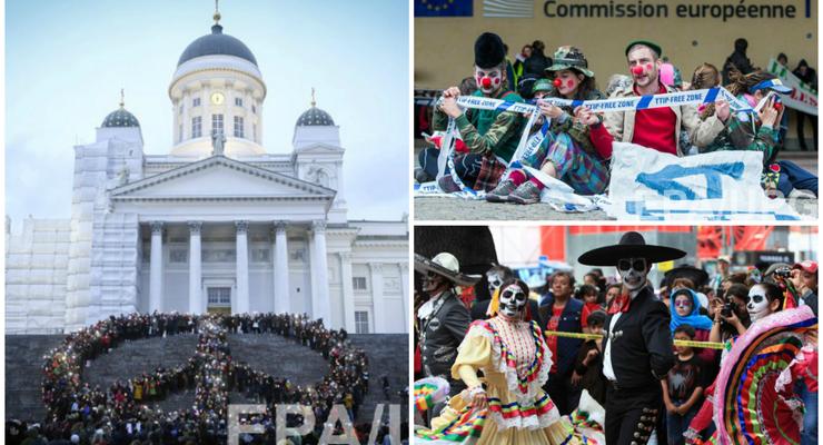 Неделя в фото: акция клоунов в Брюсселе, парад в Мехико и знак мира в Хельсинки