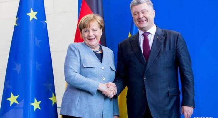 Меркель осенью приедет в Украину - Порошенко