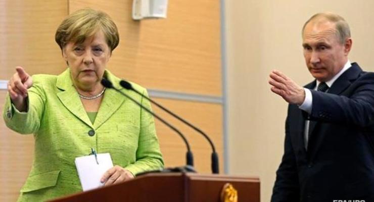 Путин обсудил с Меркель конференцию по Ливии в Берлине