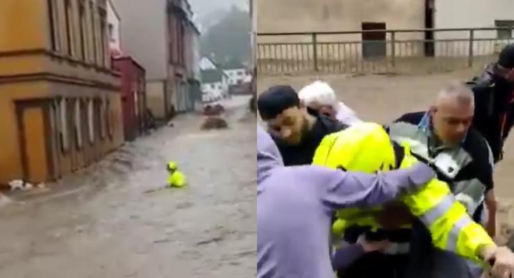 В Германии пожарного унесло мощным потоком во время наводнения - видео